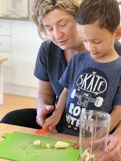 An image of an instructor assisting a child and offering childcare services.