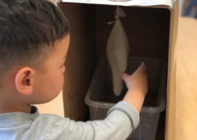 An image of a kid doing an activity with a prop in the best childcare near me.