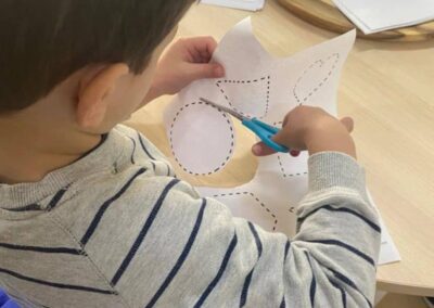 An image of a kid cutting the circle diagram in childcare brooklyn.