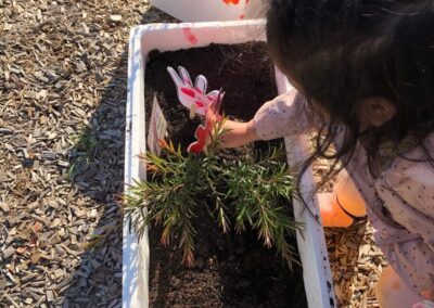 An image of a kid doing plantation in a childcare st albans.