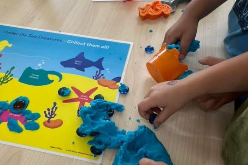 An image of a child playing with blocks in childcare brooklyn.