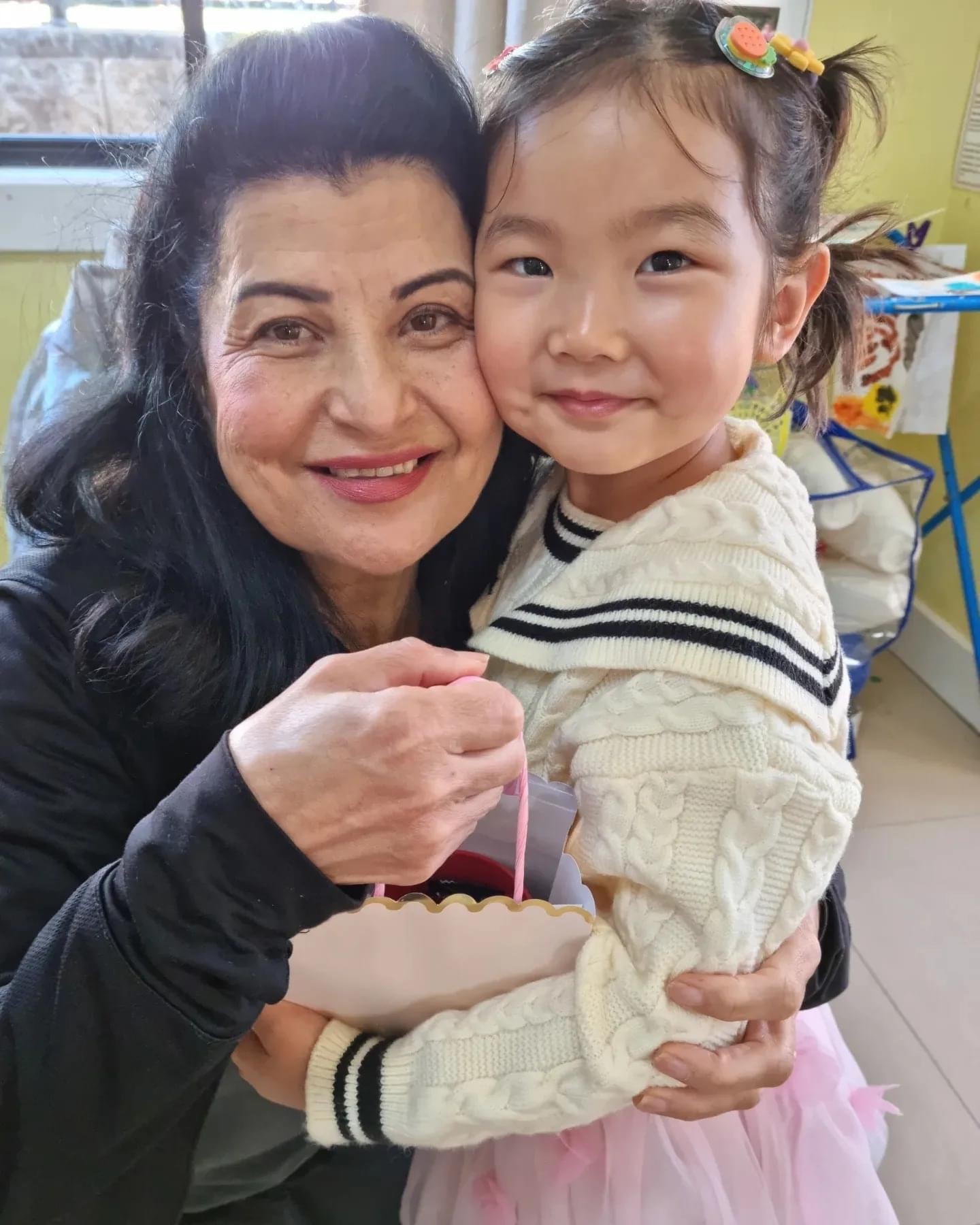 An image of an educator with a child at shine